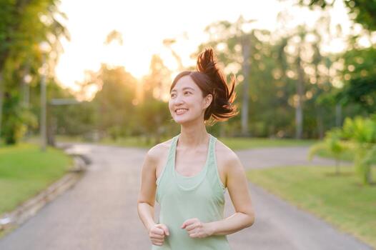 files/fit-asian-young-woman-jogging-in-park-smiling-happy-running-and-enjoying-a-healthy-outdoor-lifestyle-female-jogger-fitness-runner-girl-in-public-park-healthy-lifestyle-and-wellness-be.jpg